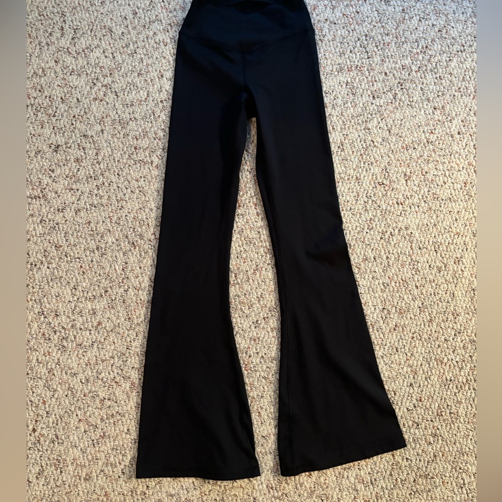 Shop Talulah - butter soft flared leggings with crossed waist band